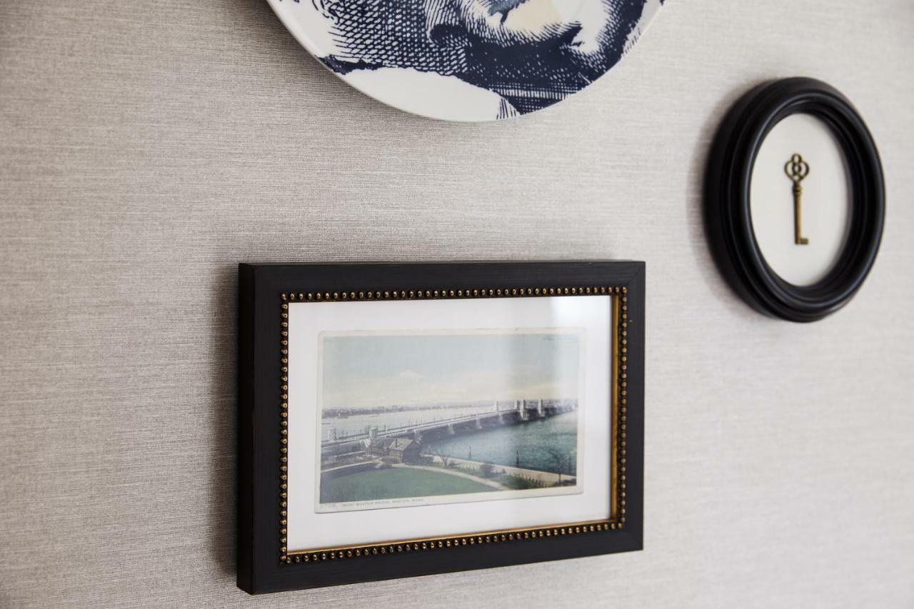 The Whitney Hotel Boston Exterior photo A photograph of the Golden Gate Bridge, framed and mounted on a wall