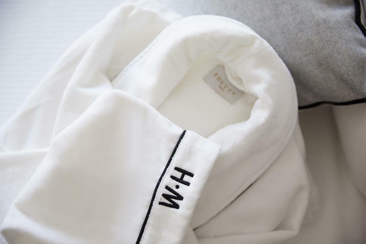 The Whitney Hotel Boston Exterior photo A white shirt with a monogram